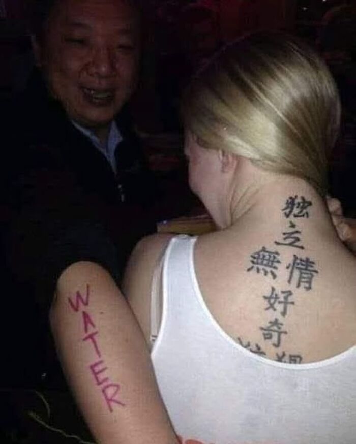 Woman with a large back tattoo in Asian characters and a man with a red "WATER" tattoo on his arm, both showing awful tattoos.