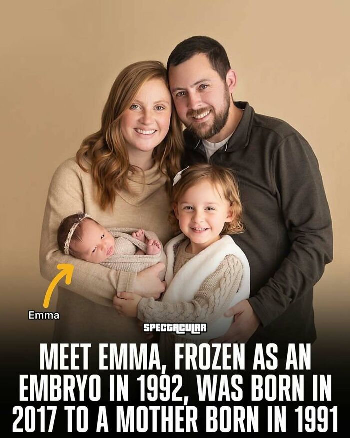 Family photo showing a smiling couple with two children, highlighting adorable and wholesome posts to brighten your feed.