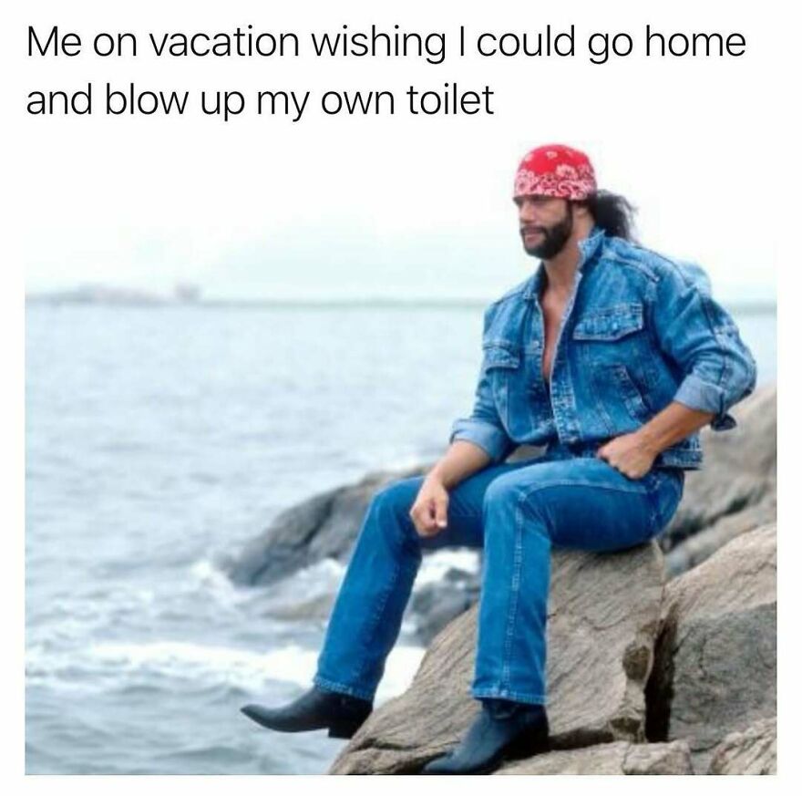 Man in denim jacket and jeans sitting on rocks by the ocean, caption about vacation and dad humor memes.