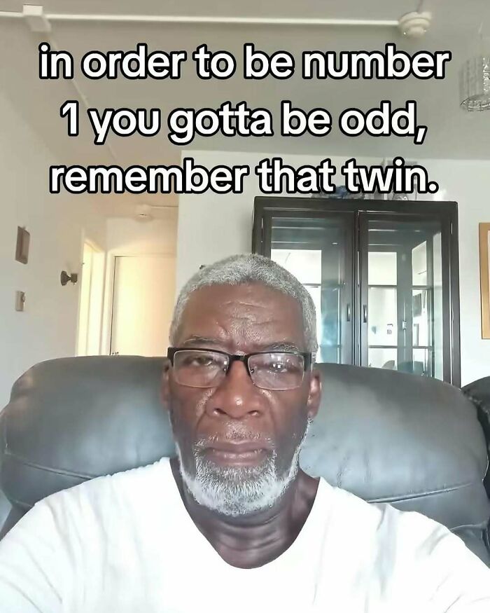 Man with glasses sitting in a chair with meme text about being odd, suitable for posts that hit different at 3AM memes.