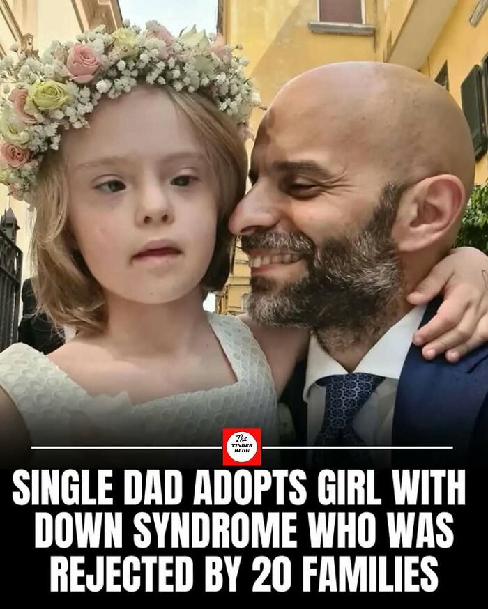 Single dad and girl with Down syndrome sharing a loving moment, showcasing adorable and wholesome posts to brighten your feed.