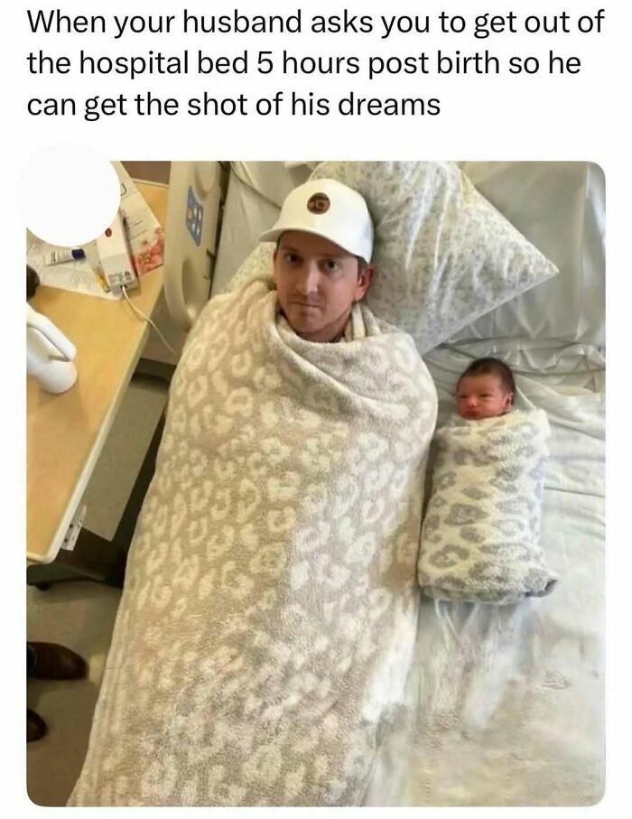 Man and newborn baby wrapped in matching blankets, creating a cute and funny serotonin boost moment.