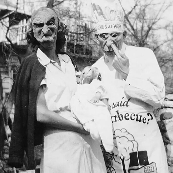 Vintage Halloween costumes with eerie masks and props, showcasing terrifying and impressive outfits from the past.