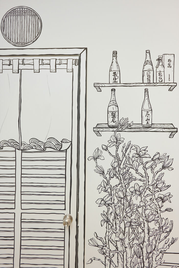 Black and white 2D restaurant wall art in NYC with hand-drawn shelves, bottles, door, and flowering plant illustrations. Black and white 2D restaurant wall art in NYC with hand-drawn shelves, bottles, door, and flowering plant illustrations.