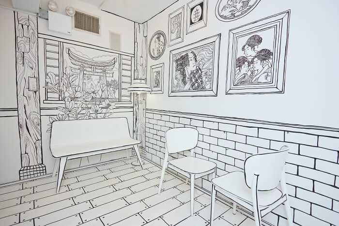 Interior of a 2D restaurant in NYC designed to look like stepping into a hand-drawn black and white drawing. Interior of a 2D restaurant in NYC designed to look like stepping into a hand-drawn black and white drawing.