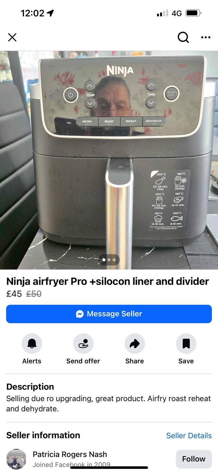 Reflection of a person seen on the glass surface of a Ninja air fryer, highlighting mirror and reflection selling humor.