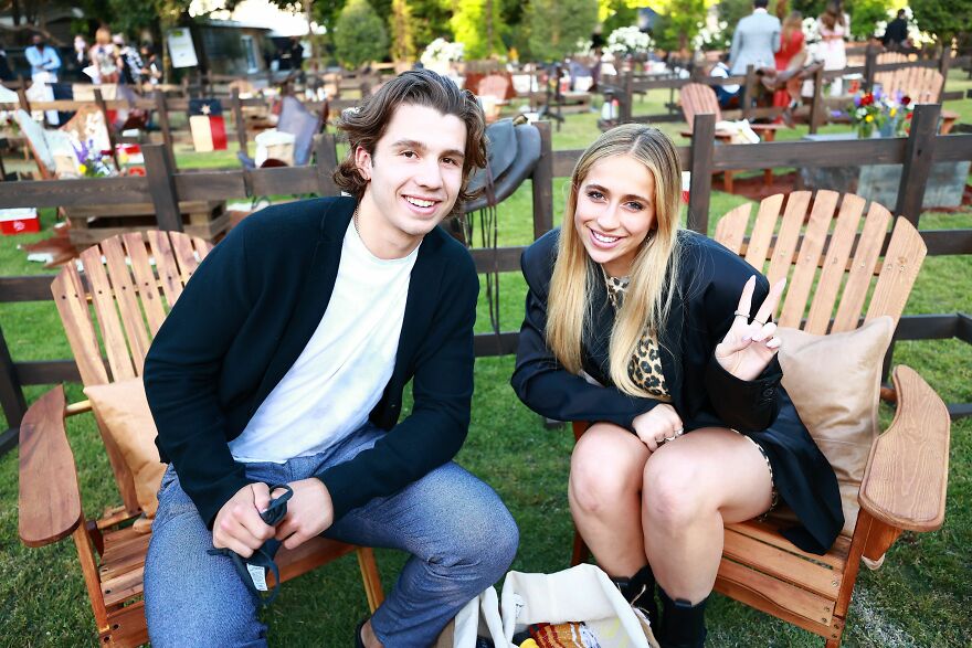 Tate Mcrae smiling while sitting outdoors in wooden chair, highlighting streaming platforms driving net worth growth in 2025. Tate Mcrae smiling while sitting outdoors in wooden chair, highlighting streaming platforms driving net worth growth in 2025.