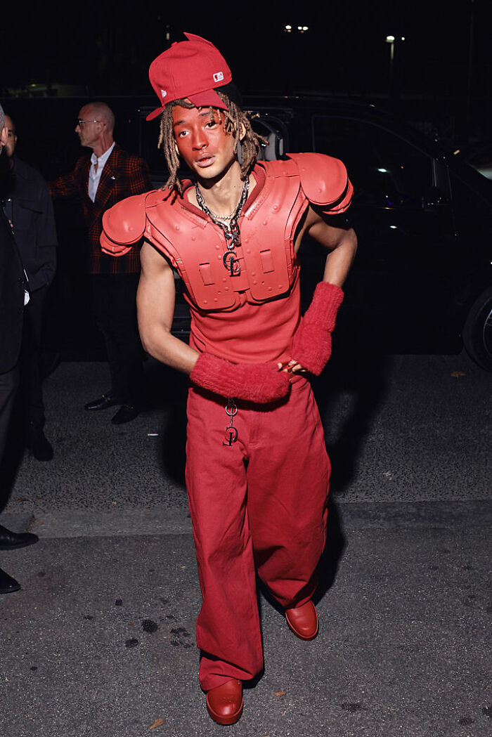 Jaden Smith wearing red football pads, matching hat and gloves, sporting a red-faced diaper look at night in Paris. Jaden Smith wearing red football pads, matching hat and gloves, sporting a red-faced diaper look at night in Paris.
