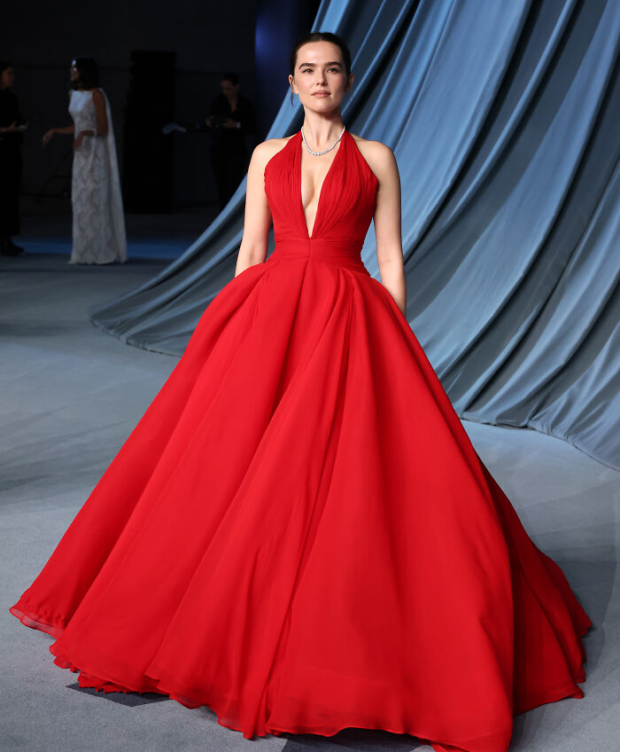 Woman wearing a red ball gown on the 2025 Academy Museum Gala red carpet showcasing must-see looks.