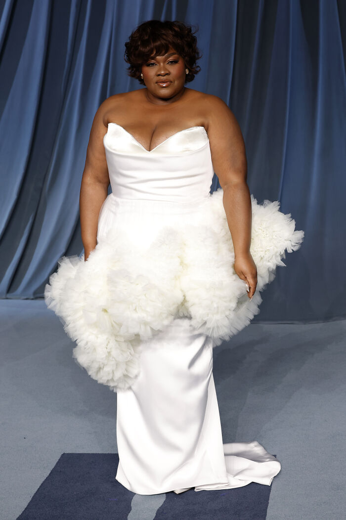 Fashion-forward look at the 2025 Academy Museum Gala red carpet featuring a white dramatic ruffled gown.