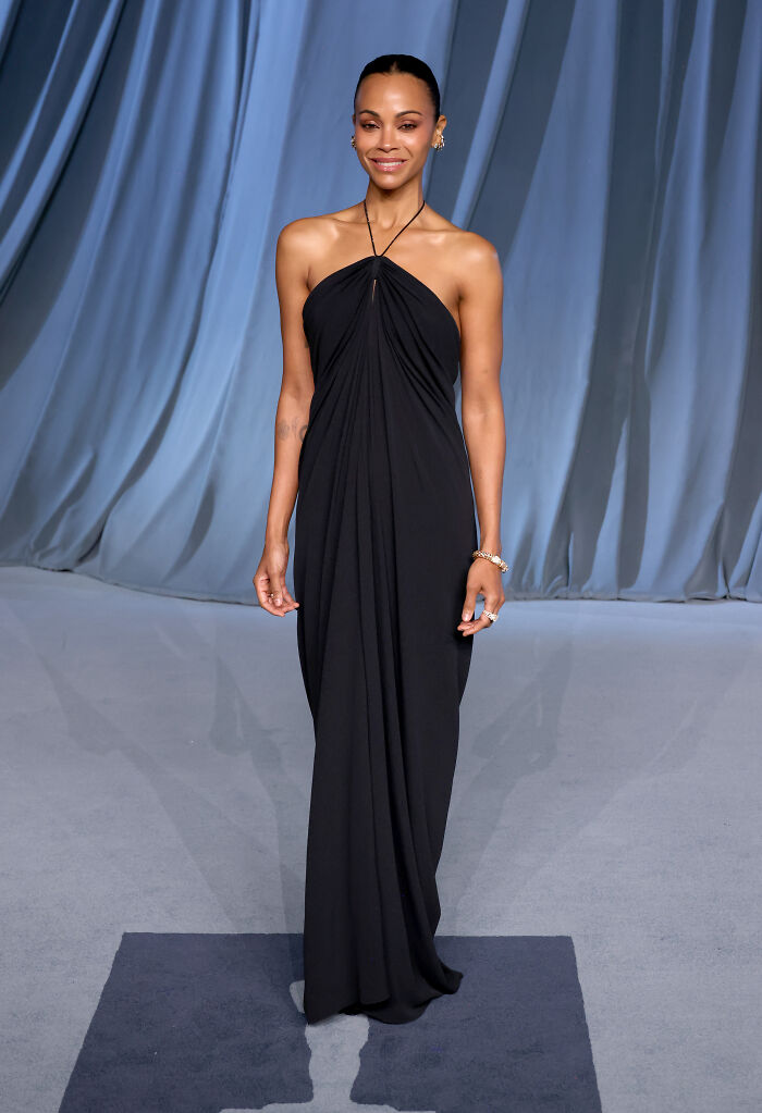 Woman in elegant black halter gown posing on the 2025 Academy Museum Gala red carpet showcasing must-see looks.
