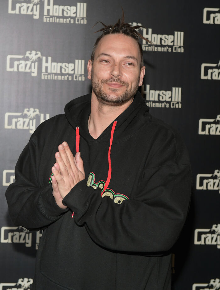 Kevin Federline standing in front of a Crazy Horse III backdrop, wearing a black hoodie with red drawstrings. Kevin Federline standing in front of a Crazy Horse III backdrop, wearing a black hoodie with red drawstrings.