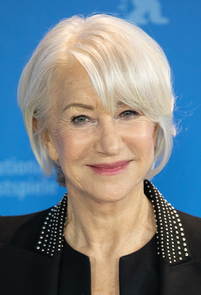 Close-up of a Hollywood star with short white hair smiling, representing stars who found fame after 30.