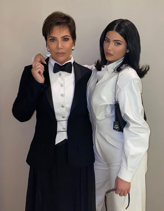 Kris Jenner and Kylie Jenner posing together in stylish black and white outfits during Kris Jenners latest public appearance.