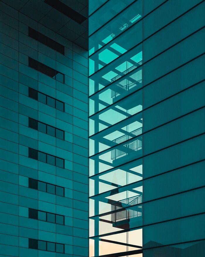 Minimalist architectural design with clean lines and geometric patterns in a modern building exterior by Olle L.