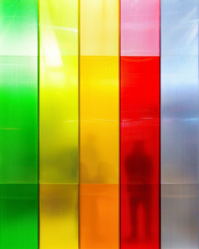 Colored translucent architectural panels in green, yellow, red, and blue reflecting minimalist architectural vision by Olle L