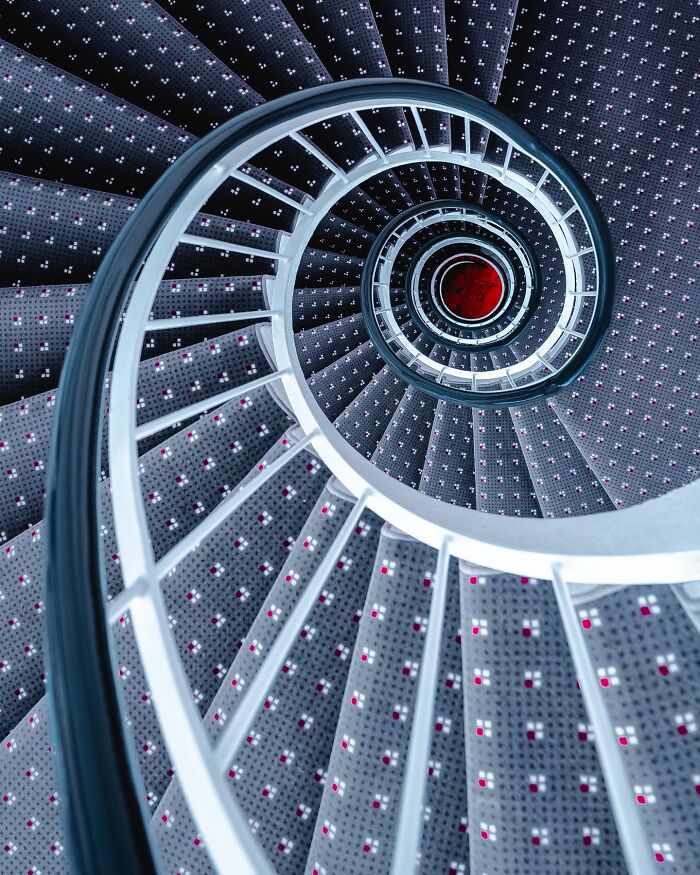 Spiral staircase with minimalist architectural design and clean lines showcasing the minimalist architectural vision.