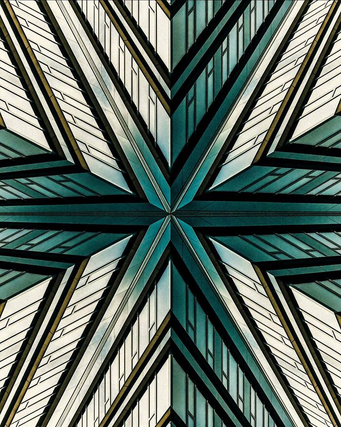 Symmetrical minimalist architectural design showcasing sharp lines and glass panels in Olle L inspired vision.