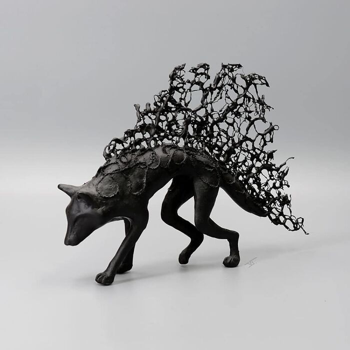 Porcelain sculpture of a haunting mythical creature with intricate latticework resembling relics of forgotten myths.