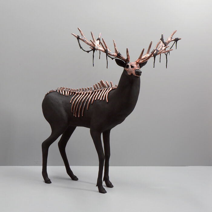 Porcelain sculpture of a haunting deer with skeletal and antler details resembling relics of forgotten myths.