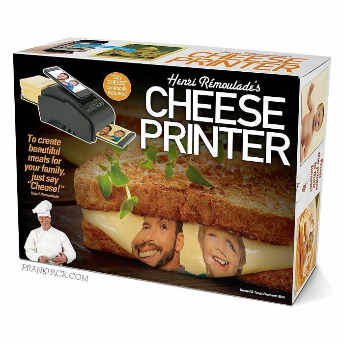 Fake gift box of a cheese printer prank showing a grilled cheese sandwich with smiling faces on the cheese slice inside the packaging.