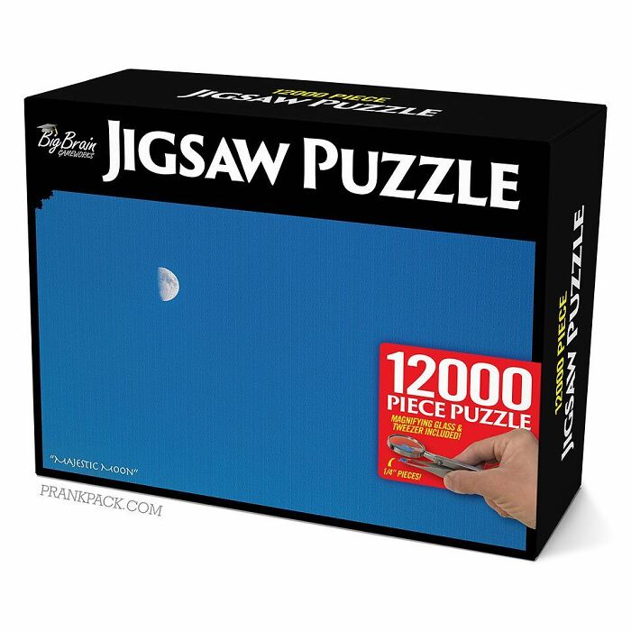 Fake gift box showing a humorous 12,000-piece jigsaw puzzle with a nearly empty blue sky and a small moon image.