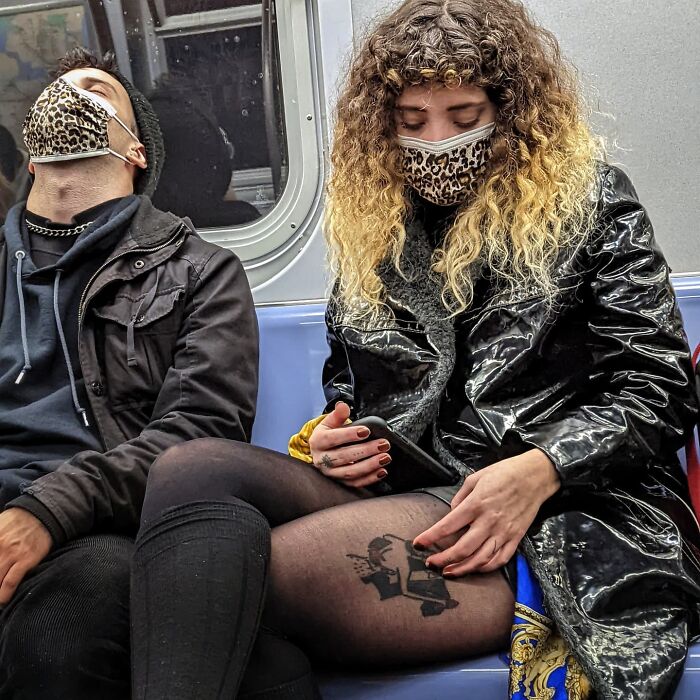Two people wearing leopard print masks on NYC subway, capturing street portraits life underground.