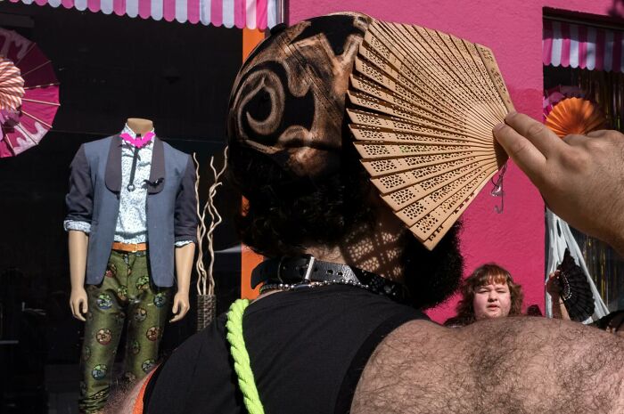 Street photographer captures humor and chaos in everyday life with vibrant colors and unique street scenes.