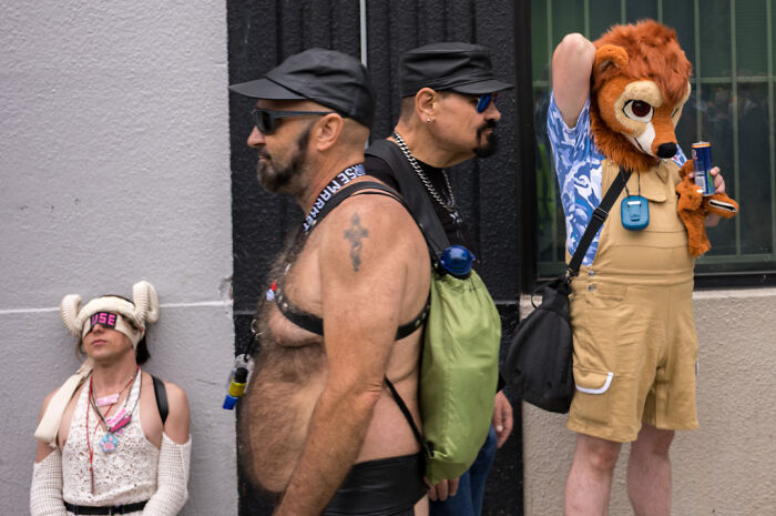 Street photographer captures humor and chaos in everyday life with candid shots of diverse urban characters and moments.