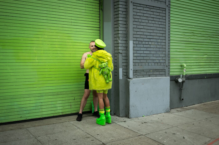 Street photographer captures humor and chaos in everyday life with vibrant characters and unexpected moments on city streets.