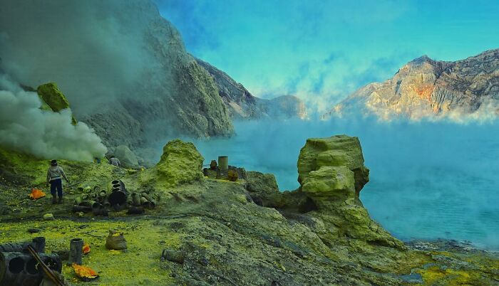 Landscape with sulfur rocks and steam rising from the ground, captured in candid photos showcasing life’s beauty.