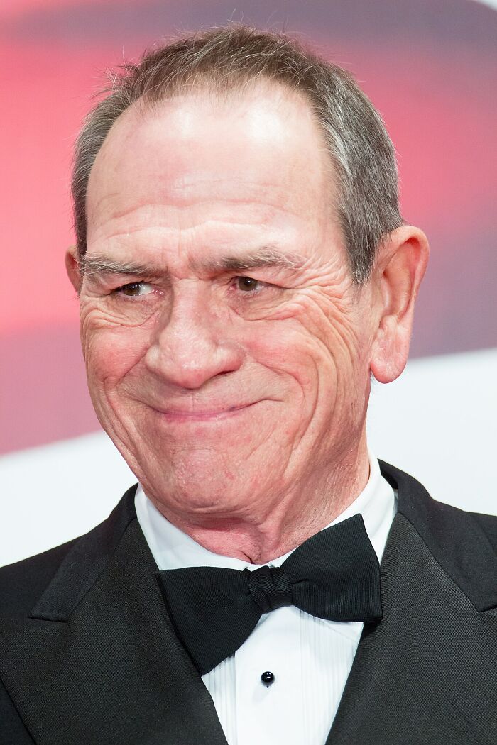 Close-up of a smiling Hollywood star in a tuxedo, exemplifying actors who found fame after 30 in the film industry.