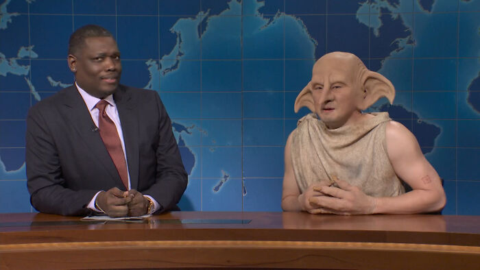 SNL segment featuring a cast member in costume mocking J.K. Rowling over trans rights in a news desk parody.