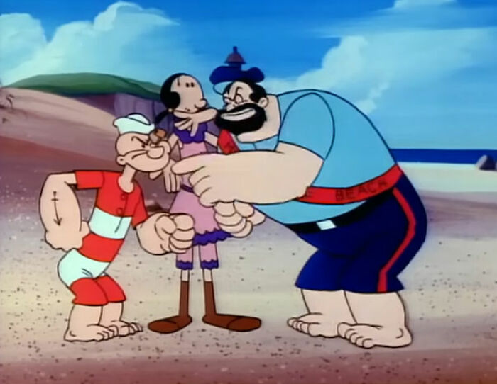 Three cartoon characters, including Popeye, interacting on a sandy beach in a seaside setting, bizarre things inside houses.