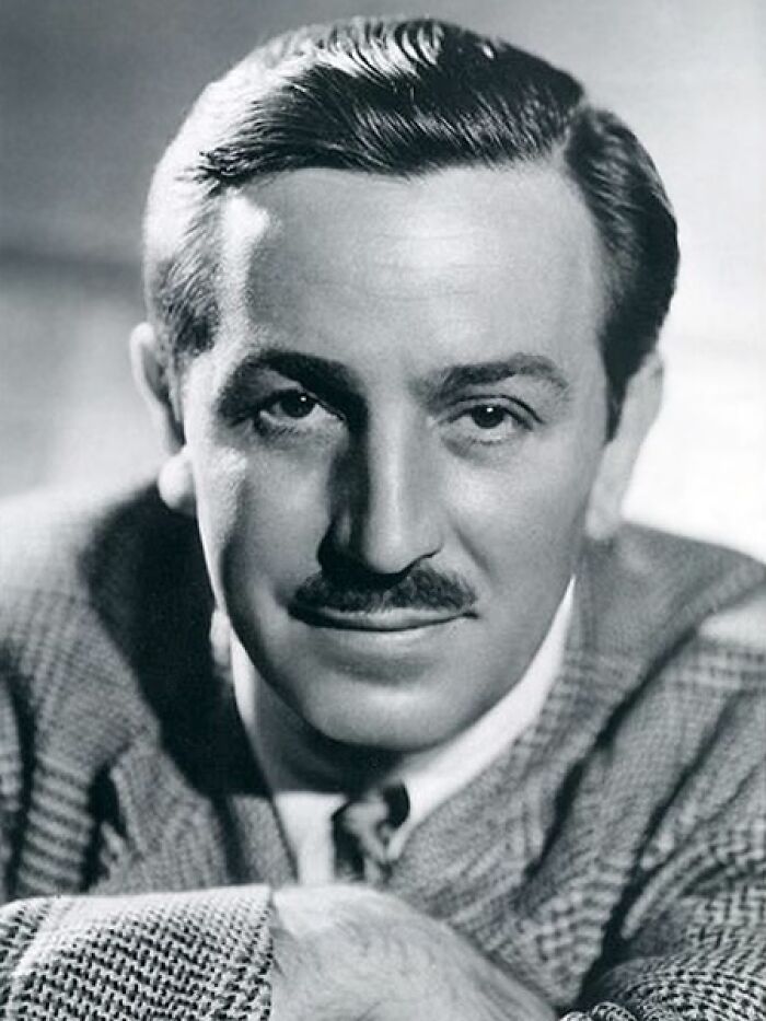 Black and white portrait of a man with a mustache and slicked-back hair, reflecting times people were disappointed in idols.