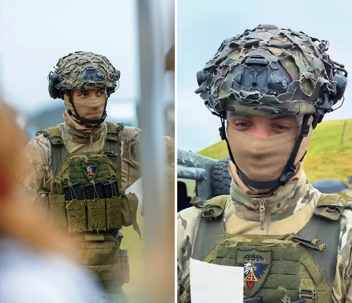Soldier wearing camouflage gear reacting to his own portrait captured by a photographer recording honest reactions.