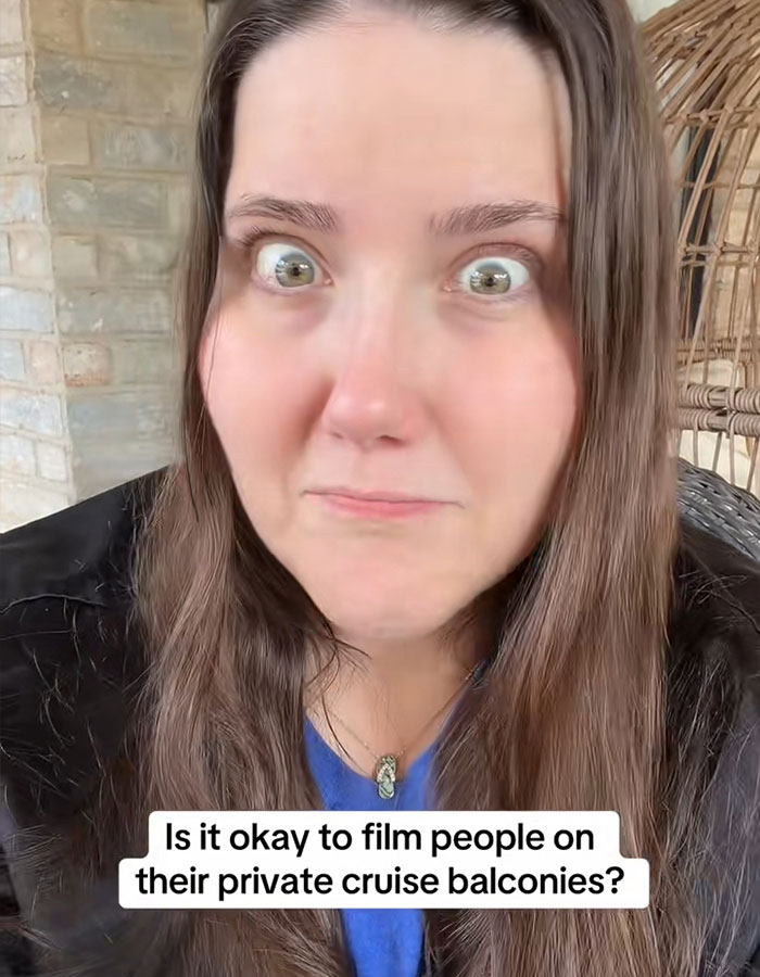 Woman reacting in a video discussing the viral cruise balcony strangers sleeping incident and privacy debate online.