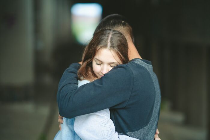 A couple embracing closely, sharing a tender moment demonstrating key relationship advice for every couple to know.