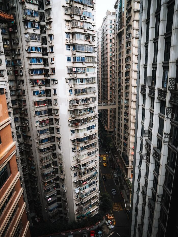 Dense high-rise residential buildings in a crowded urban environment depicting a $58 billion ghost city.