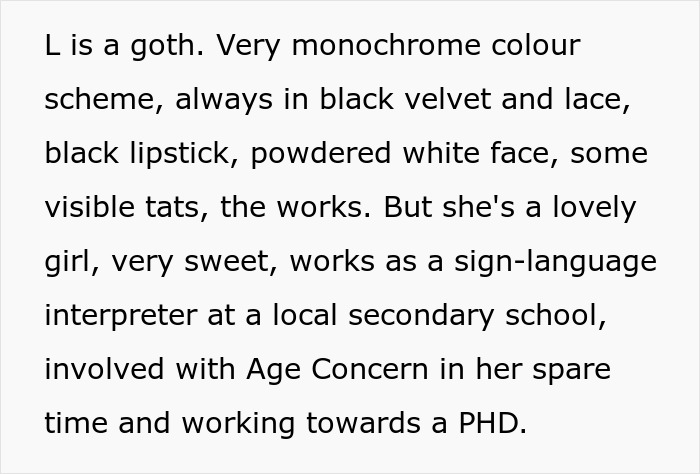 Text describing a goth woman with a monochrome style, black velvet and lace, black lipstick, and visible tattoos.