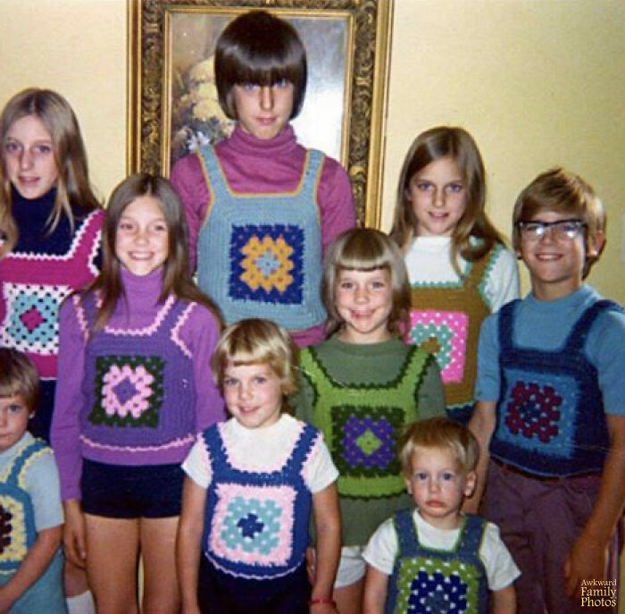 Group of children wearing matching crocheted vests in a vintage family photo prone to cringe and laughter online