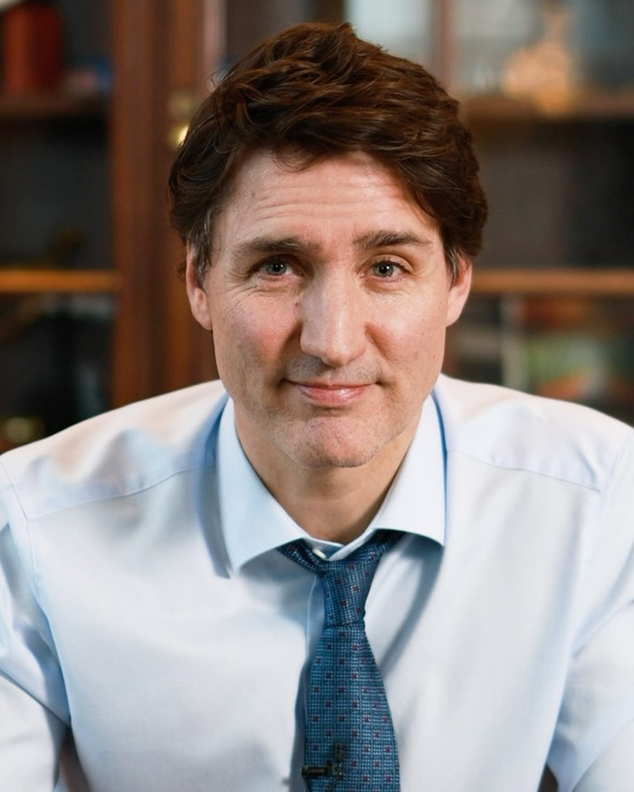 Canadian Prime Minister Justin Trudeau in a blue shirt and tie, featured in memes about brain damage from that space journey.