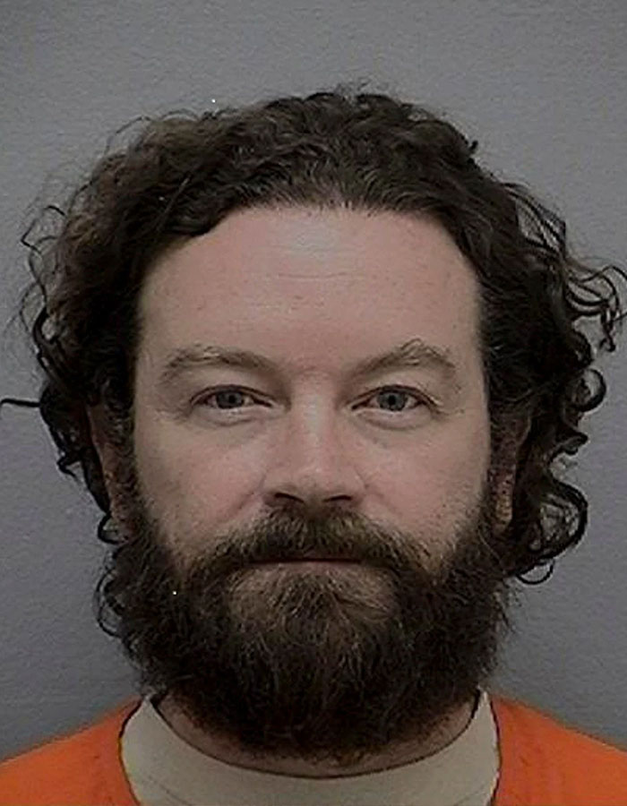 Mugshot of Danny Masterson with beard and curly hair, representing jailed husband in Bijou Phillips cutting ties story.