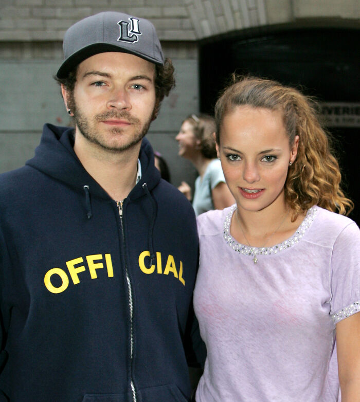 Bijou Phillips and Danny Masterson posing together outdoors, highlighting Bijou Phillips cutting ties with jailed husband.