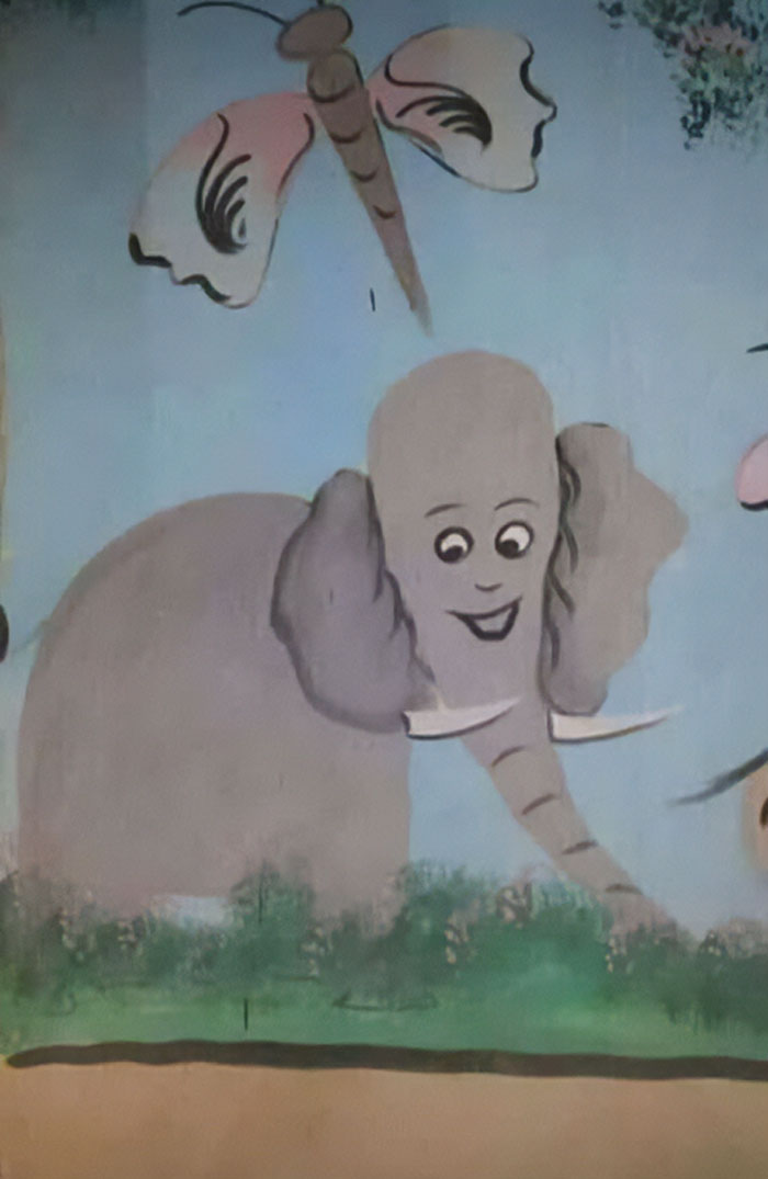 Weird and cursed cartoon elephant with a dragonfly painted on a blue wall in a surreal scene.