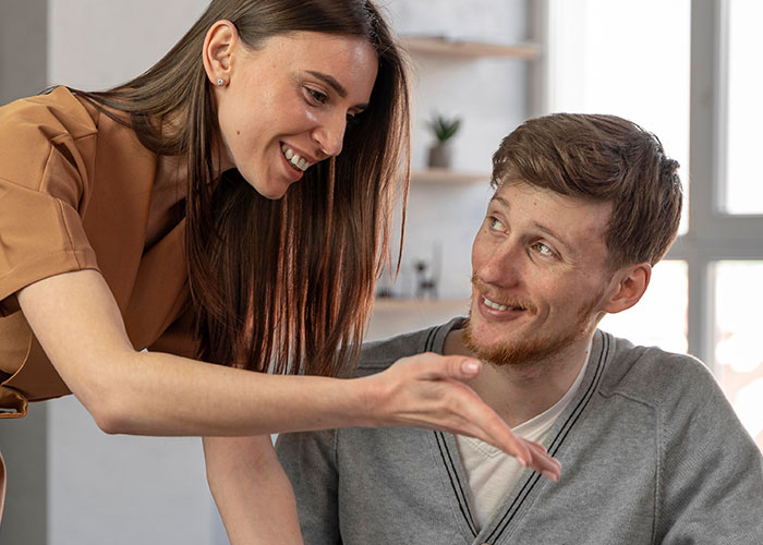 Man looking confused while girlfriend talks to him about his work wife sending hearts and mirror selfies at home. Man looking confused while girlfriend talks to him about his work wife sending hearts and mirror selfies at home.