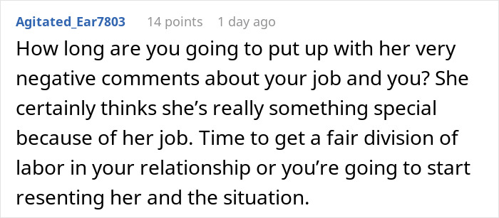 Man upset sitting at table, holding unwanted puppy, overwhelmed by new pet responsibility at home.