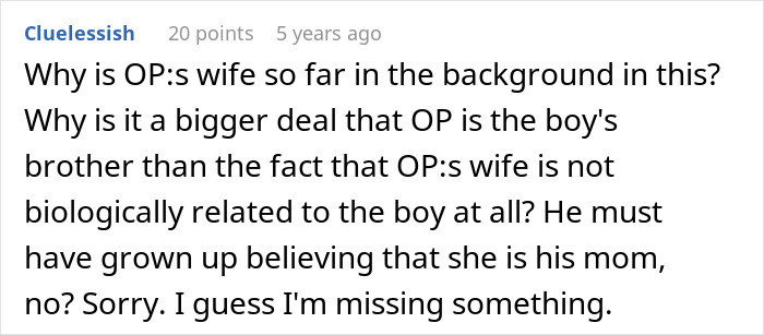 Screenshot of a Reddit comment questioning why a boy has no idea about his real parents amid family relationship confusion.