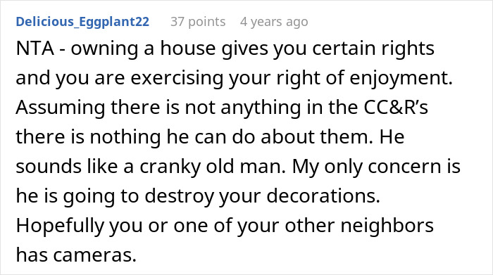 Screenshot of an online comment discussing neighbor threats over elaborate Halloween decorations and property rights.