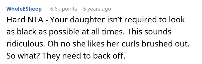 Comment from user WholeESheep defending mom after criticism about brushing biracial daughter&rsquo;s curls amid whitewashing debate.